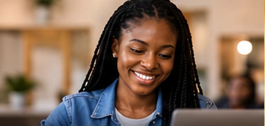 Young Black woman learning online with a laptop
